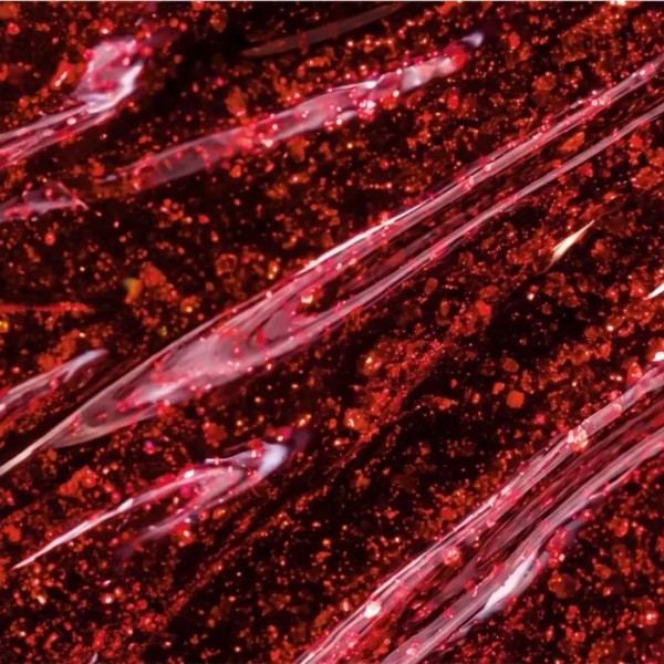  Gel Polish 482 Red Marble detalle de la textura roja con partículas brillantes y reflejos luminosos